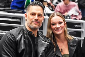 Joe Manganiello and Caitlin O'Connor pose for a photo during the second period between the Vancouver Canucks and the Los Angeles Kings at Crypto.com Arena on March 5, 2024 in Los Angeles, California.