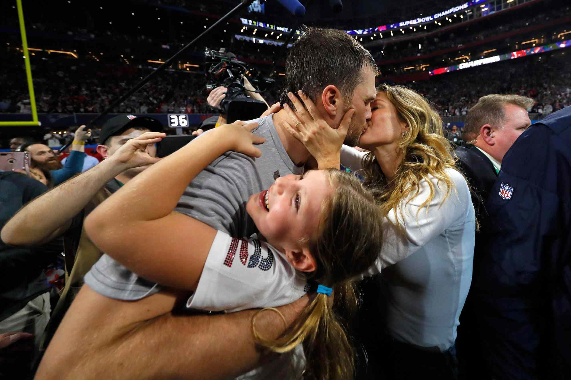 ATLANTA, GA - FEBRUARY 03: Tom Brady #12 of the New England Patriots kisses his wife Gisele Bündchen after the Super Bowl LIII against the Los Angeles Rams at Mercedes-Benz Stadium on February 3, 2019 in Atlanta, Georgia. The New England Patriots defeat the Los Angeles Rams 13-3. (Photo by Kevin C. Cox/Getty Images)