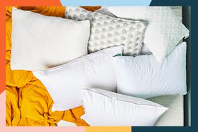 Best foam pillows arranged on bed with bright orange blanket and colorful border