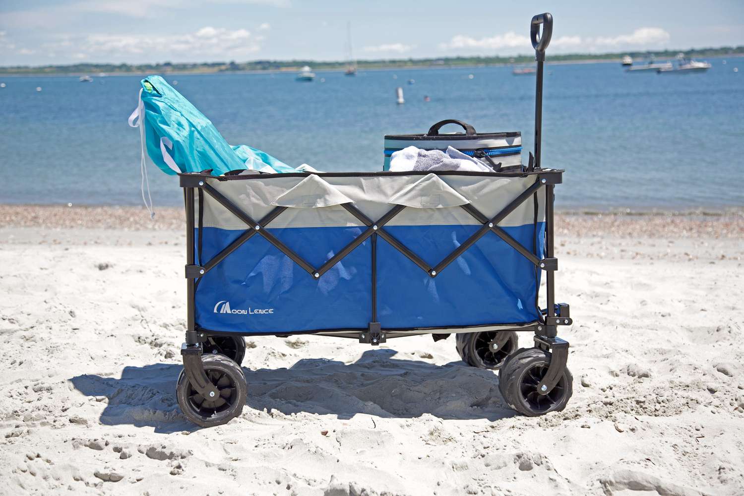 Moon Lence Collapsible Outdoor Utility Wagon sitting on sand