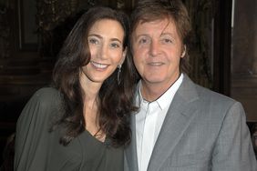 Sir Paul McCartney and Nancy Shevell attend the Stella McCartney Ready to Wear Spring/Summer 2011 show during Paris Fashion Week on October 4, 2010 in Paris, France