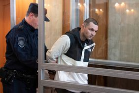 FILE U.S. Army Staff Sgt. Gordon Black is escorted into a glass cage in courtroom in Vladivostok, Russia, Thursday, June 6, 2024. U.S. soldier Gordon Black is on trial in Vladivostok on charges of theft and threatening murder in a dispute with a Russian woman. Black, who was stationed in South Korea but visiting the Pacific Coast city, on Monday, June 17, 2024 told a court that he denied the allegation of threatening murder but "partially" admitted to theft, according to the state news agency RIA-Novosti