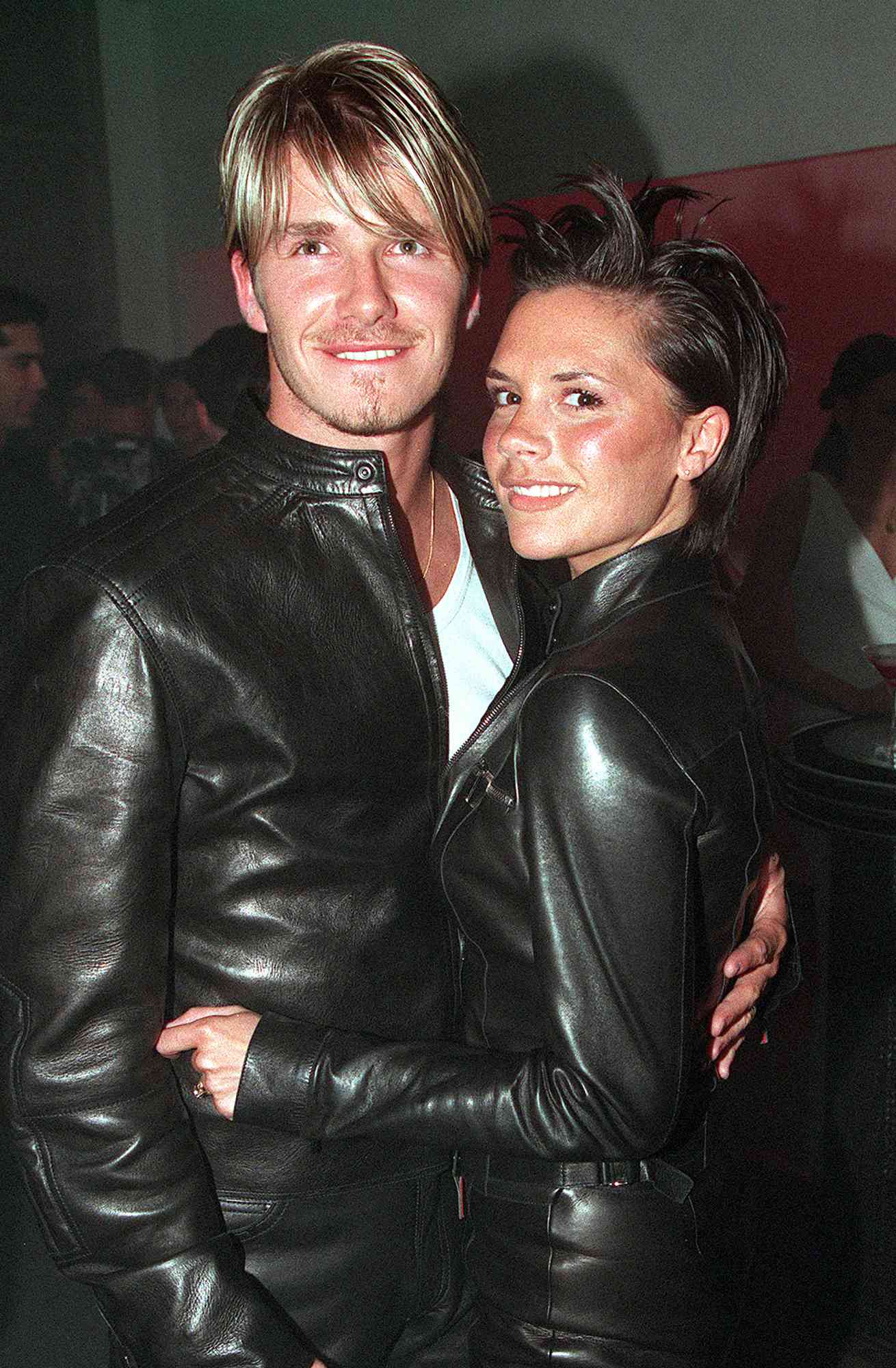 David Beckham and wife Victoria Beckham attend the Versace Store opening party on New Bond Street on June 11, 1999 in London