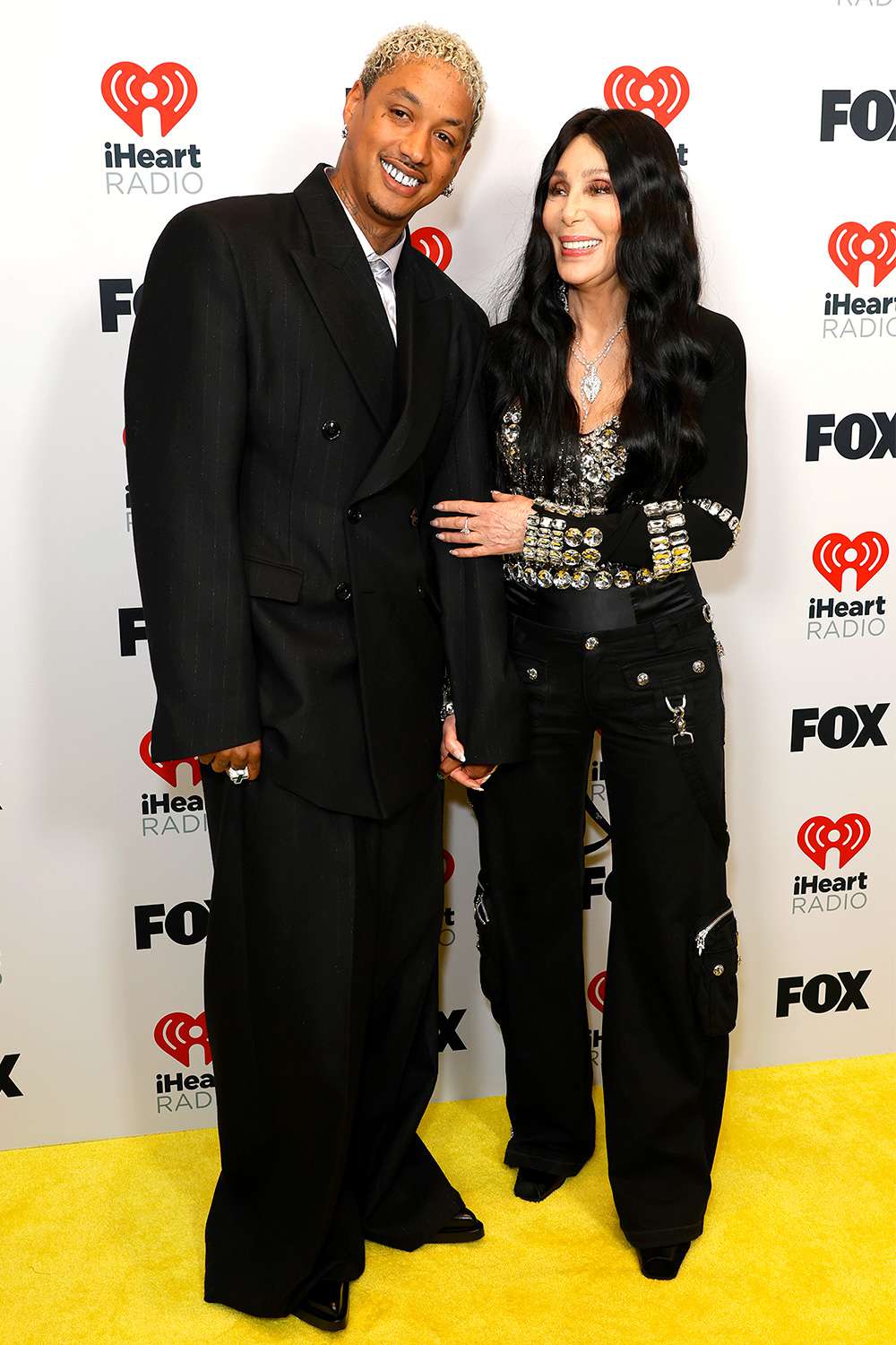 Alexander "AE" Edwards and Cher, winner of the Icon award, pose in the press room during the 2024 iHeartRadio Music Awards at Dolby Theatre on April 01, 2024 in Hollywood, California