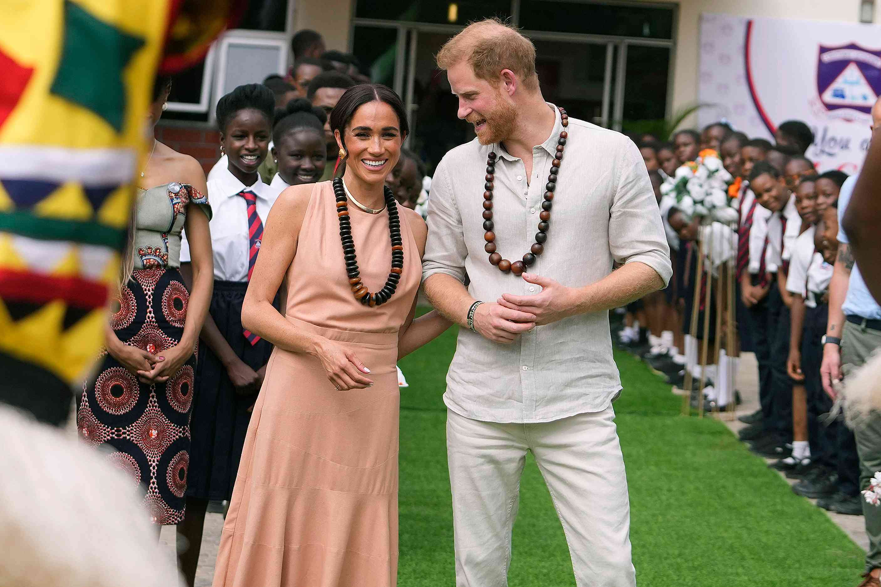 Prince Harry and Meghan visit children at the Lights Academy in Abuja, Nigeria, Friday, May 10, 2024. Prince Harry and his wife Meghan have arrived in Nigeria to champion the Invictus Games, which he founded to aid the rehabilitation of wounded and sick servicemembers and veterans.