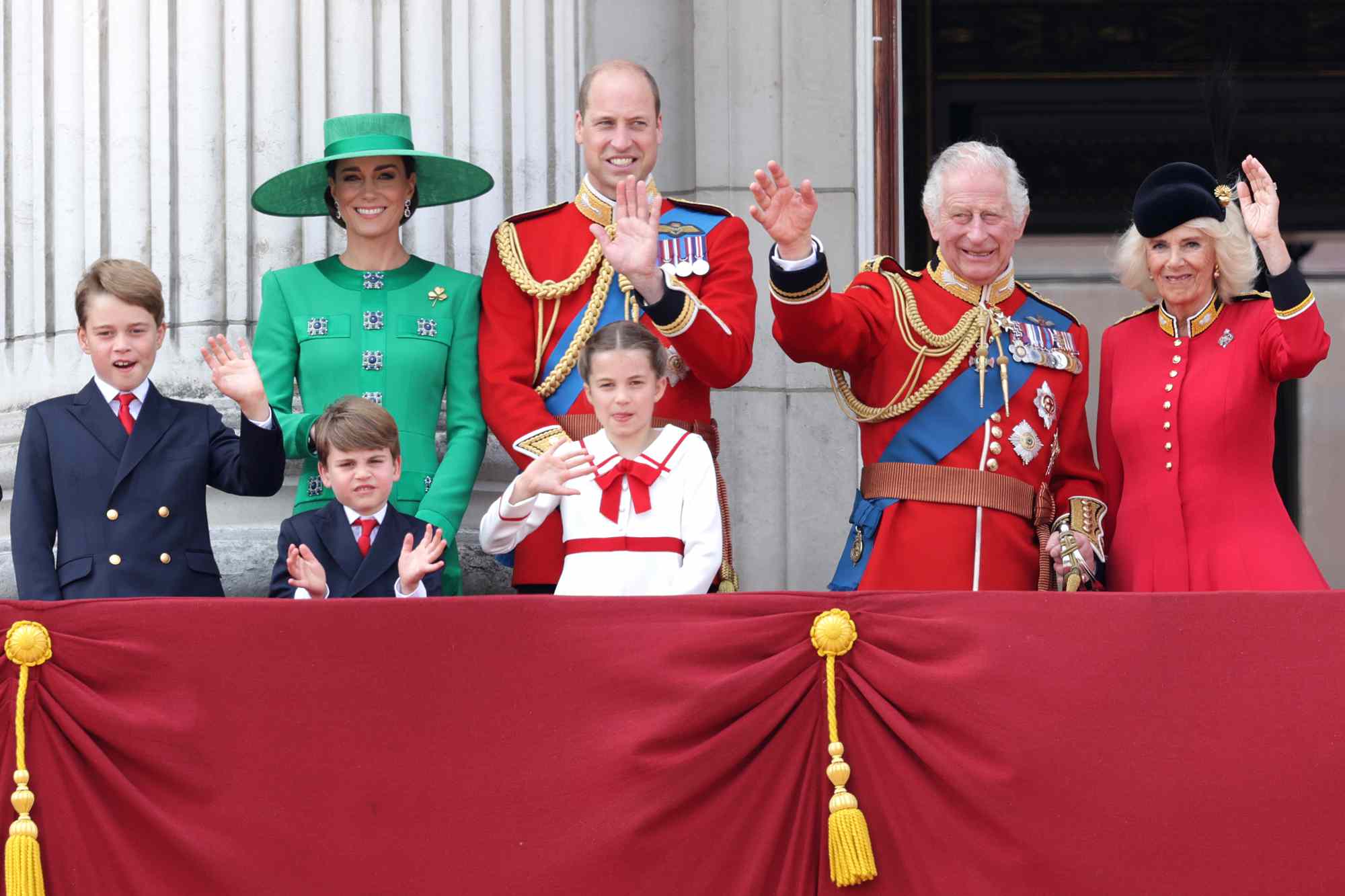 King Charles III and Queen Camilla wave alongside Prince William, Prince of Wales, Prince Louis of Wales, Catherine, Princess of Wales and Prince George