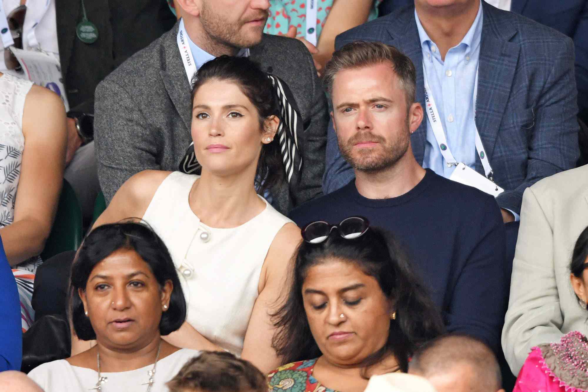 LONDON, ENGLAND - JULY 14: Gemma Arterton and Rory Keenan on Centre Court on Men's Finals Day of the Wimbledon Tennis Championships at All England Lawn Tennis and Croquet Club on July 14, 2019 in London, England. (Photo by Karwai Tang/Getty Images)