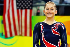 Gold medalist Shawn Johnson of the United States stands on the podium during the medal ceremony for the Women's Beam Final at the National Indoor Stadium on Day 11 of the Beijing 2008 Olympic Games on August 19, 2008 in Beijing, China