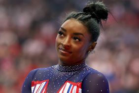 Simone Biles prepares for the floor exercise on Day Four of the 2024 U.S. Olympic Team Gymnastics Trials at Target Center on June 30, 2024 