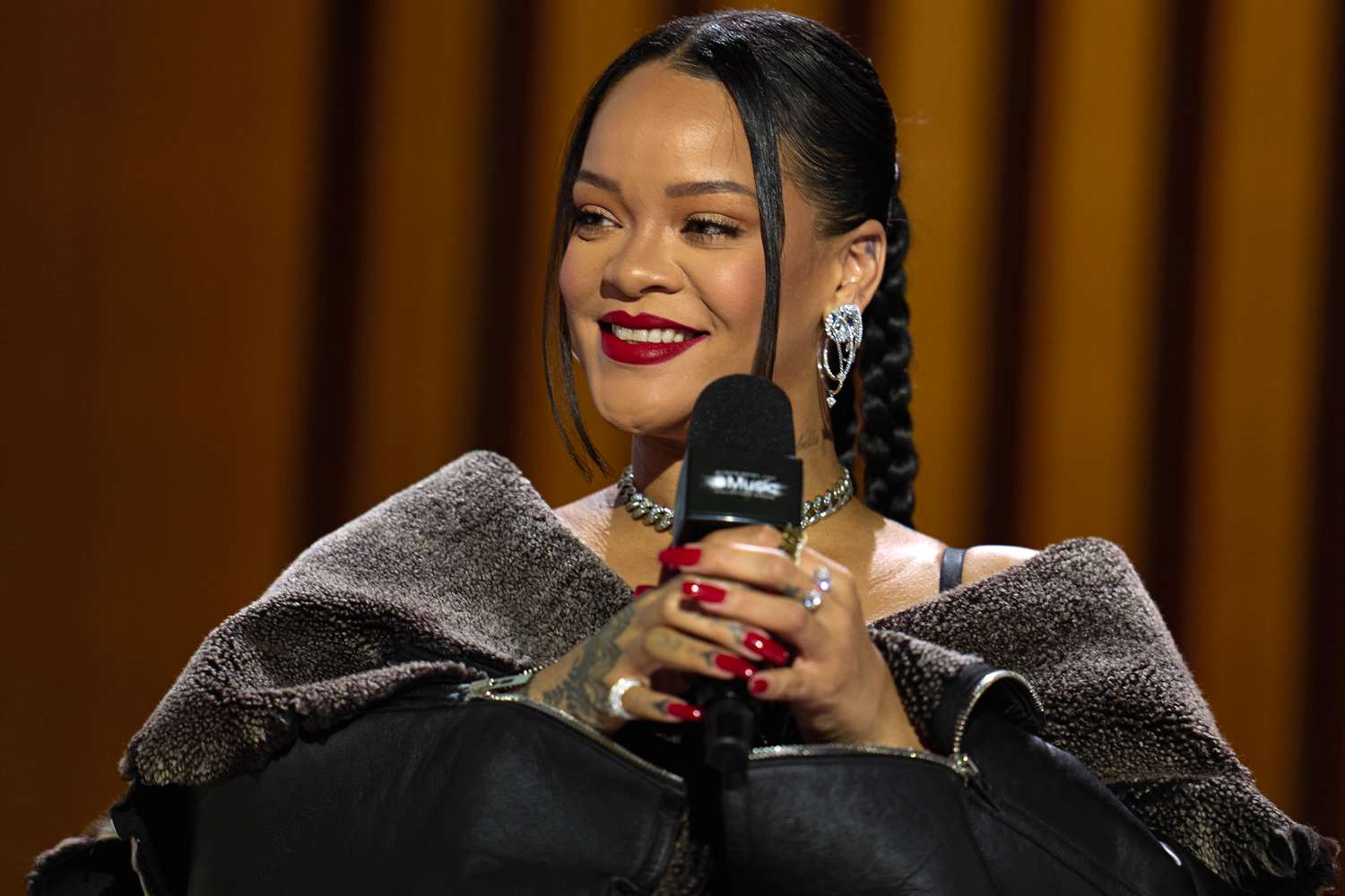 Rihanna speaks during a press conference for the Apple Music Super Bowl 57 halftime show at the Phoenix Convention Center on February 9, 2023 in Phoenix, Arizona.