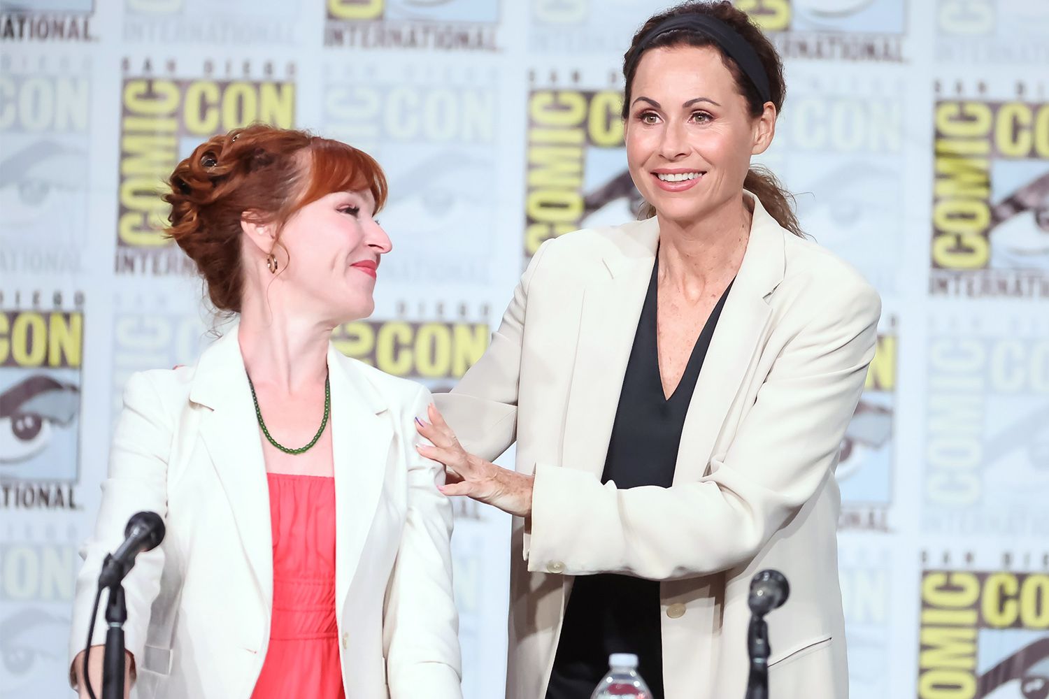 SAN DIEGO, CALIFORNIA - JULY 22: (L-R) Ruth Connell and Minnie Driver speak onstage at the "Nandor Fodor and the Talking Mongoose" panel during 2022 Comic-Con International: San Diego at San Diego Convention Center on July 22, 2022 in San Diego, California. (Photo by Amy Sussman/Getty Images)