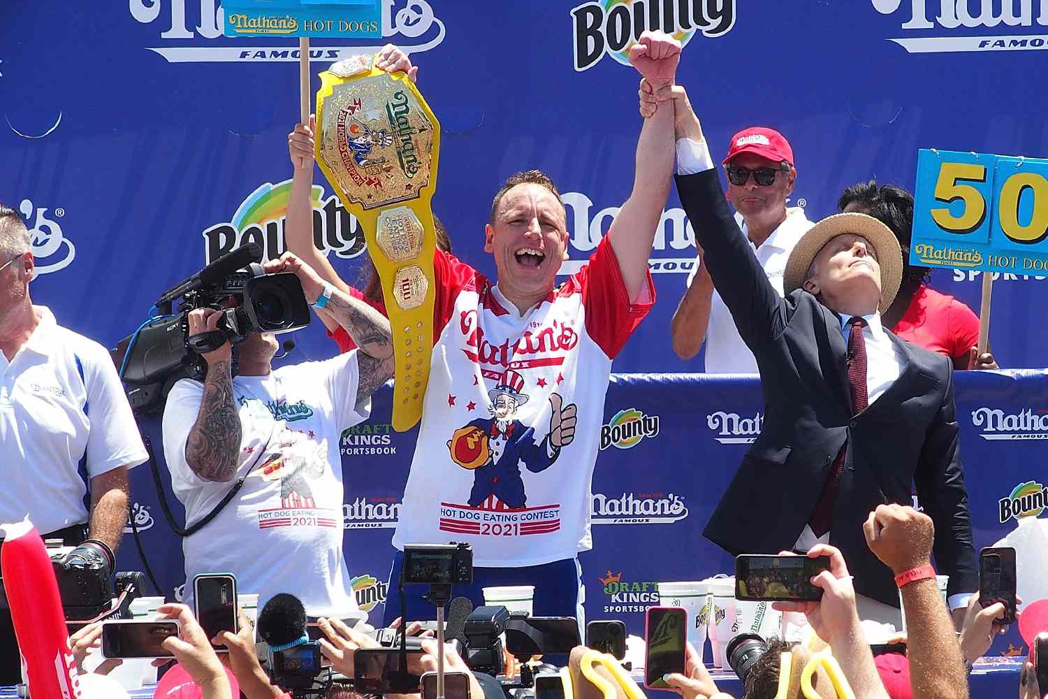 Defending Champion Joey Chestnut wins after consuming 76 hot dogs and setting a new world record at the 2021 Nathan's Famous International Hot Dog Eating Contest at Coney Island on July 4, 2021 in New York City.