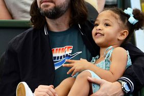 Alexis Ohanian, husband of Serena Williams of the US, watches her match against Naomi Osaka of Japan with their daughter Alexis Olympia Ohanian Jr during the 'A Day at the Drive' exhibition tournament in Adelaide on January 29, 2021