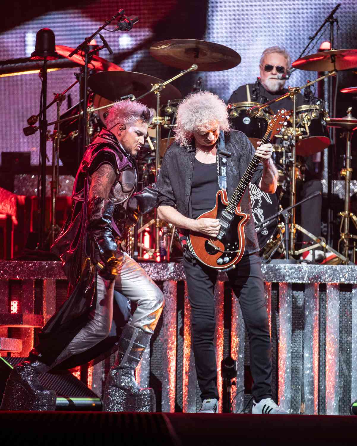 Adam Lambert performs with Brian May and Roger Taylor of Queen at Chase Center on November 08, 2023 in San Francisco, California.