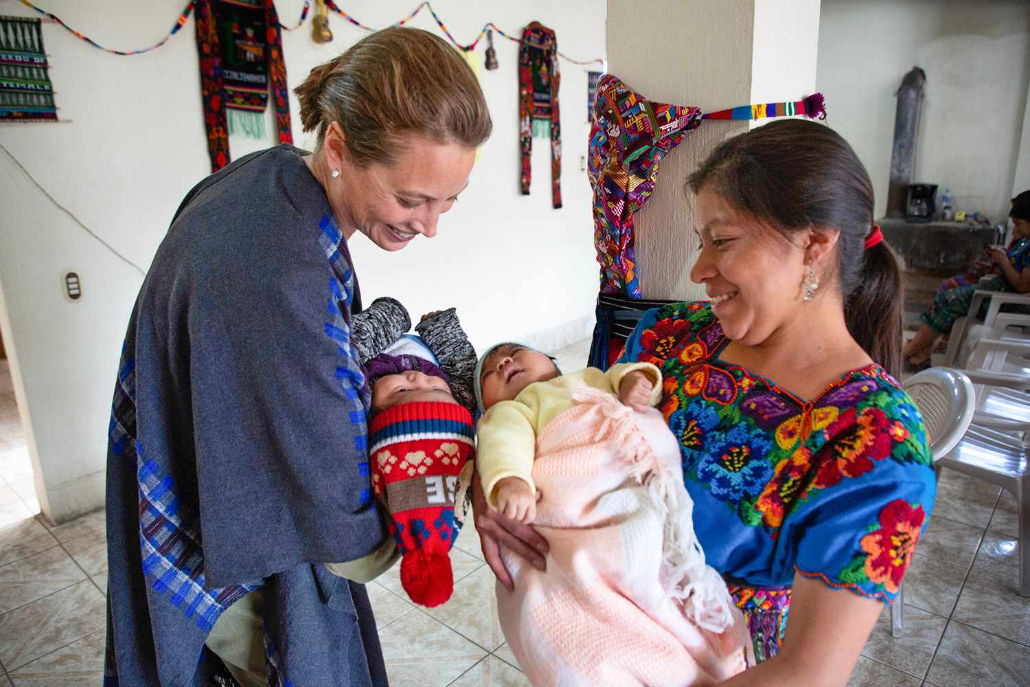 Christy Turlington Burns and a traditional midwife hold babies in Guatemala, 2019