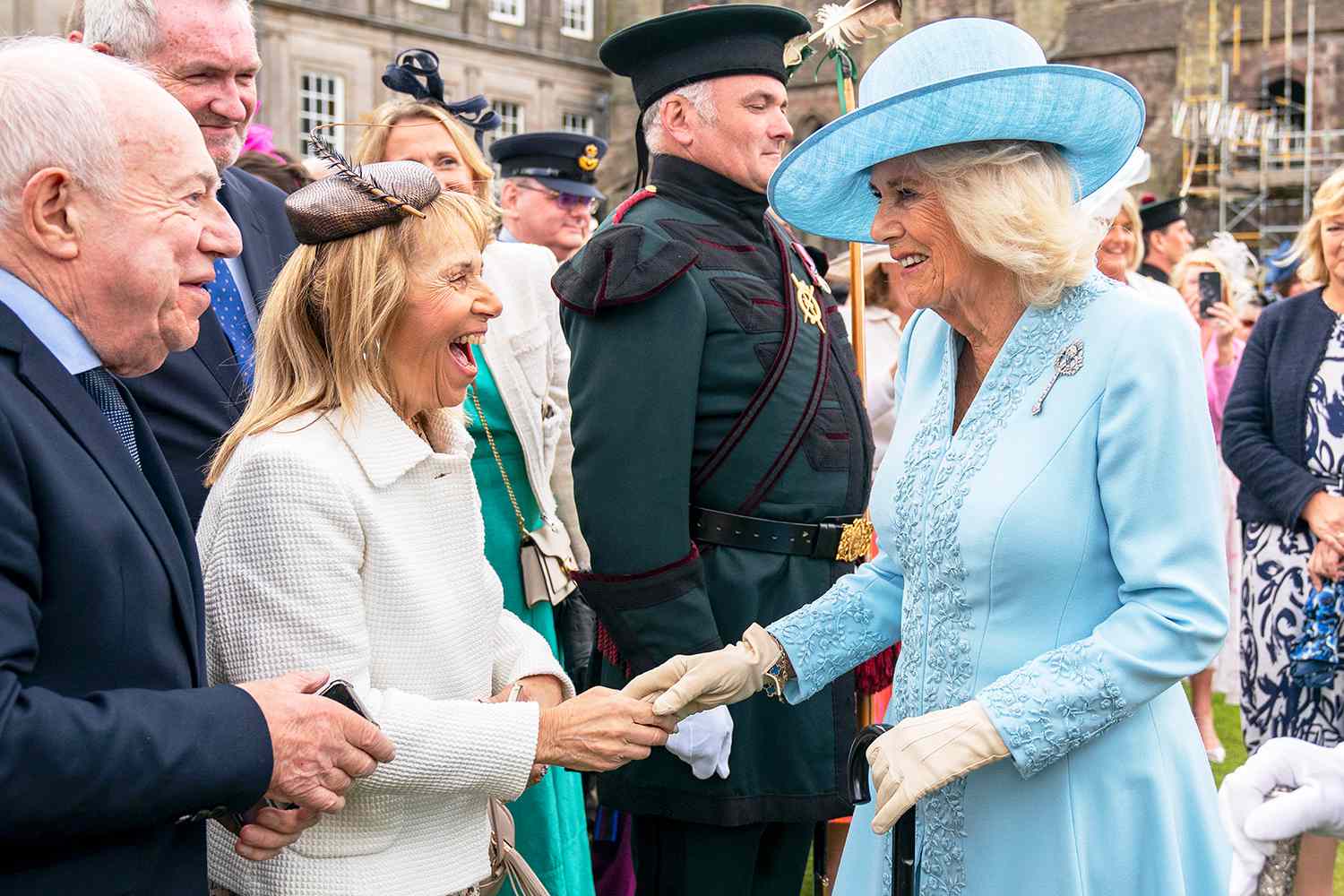 Queen Camilla greets guests during the Sovereign's Garden Party held at the Palace of Holyroodhouse on July 2, 2024 in Edinburgh, Scotland.