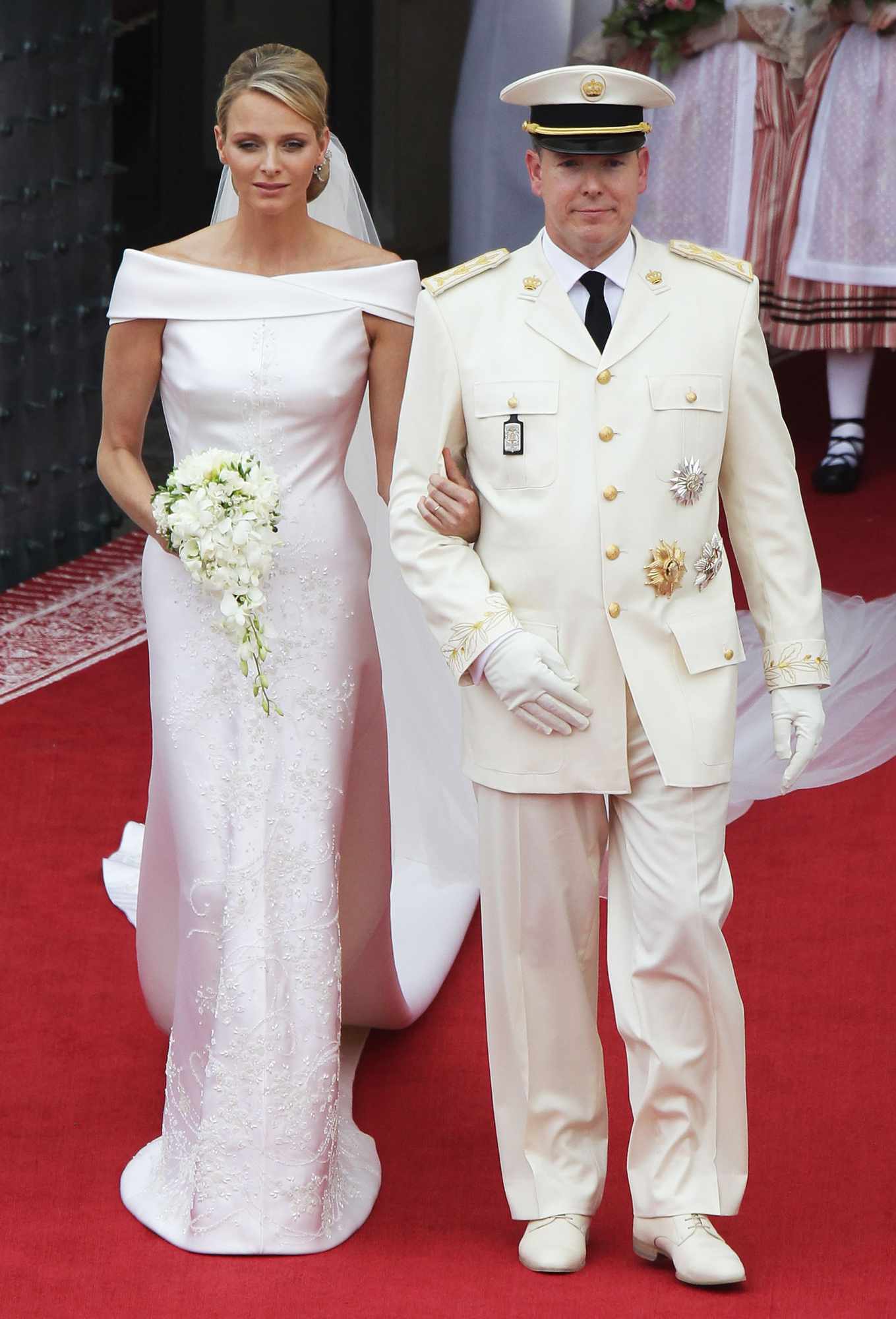 Princess Charlene of Monaco and Prince Albert II of Monaco leave the religious ceremony of the Royal Wedding of Prince Albert II of Monaco to Princess Charlene of Monaco in the main courtyard at the Prince's Palace on July 2, 2011 in Monaco. The Roman-Catholic ceremony follows the civil wedding which was held in the Throne Room of the Prince's Palace of Monaco on July 1