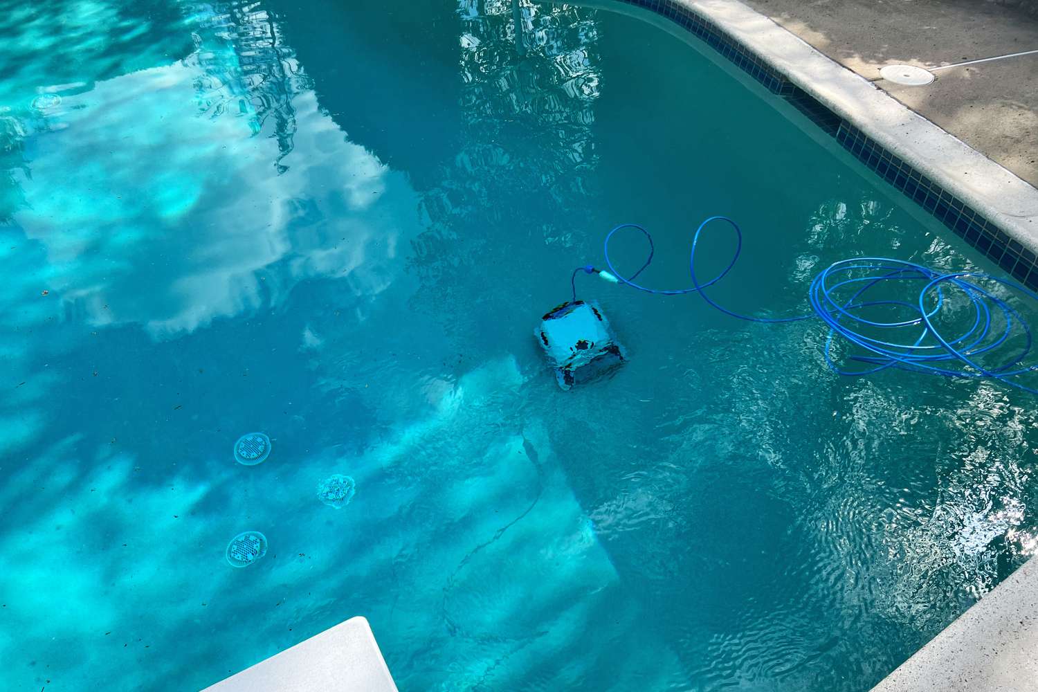 Dolphin Explorer E50 Robotic Pool Cleaner on the bottom of a pool