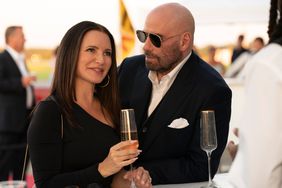 Kristin Davis as Amelia Decker and John Travolta as Mason Goddard in the Action, Heist, Thriller, CASH OUT