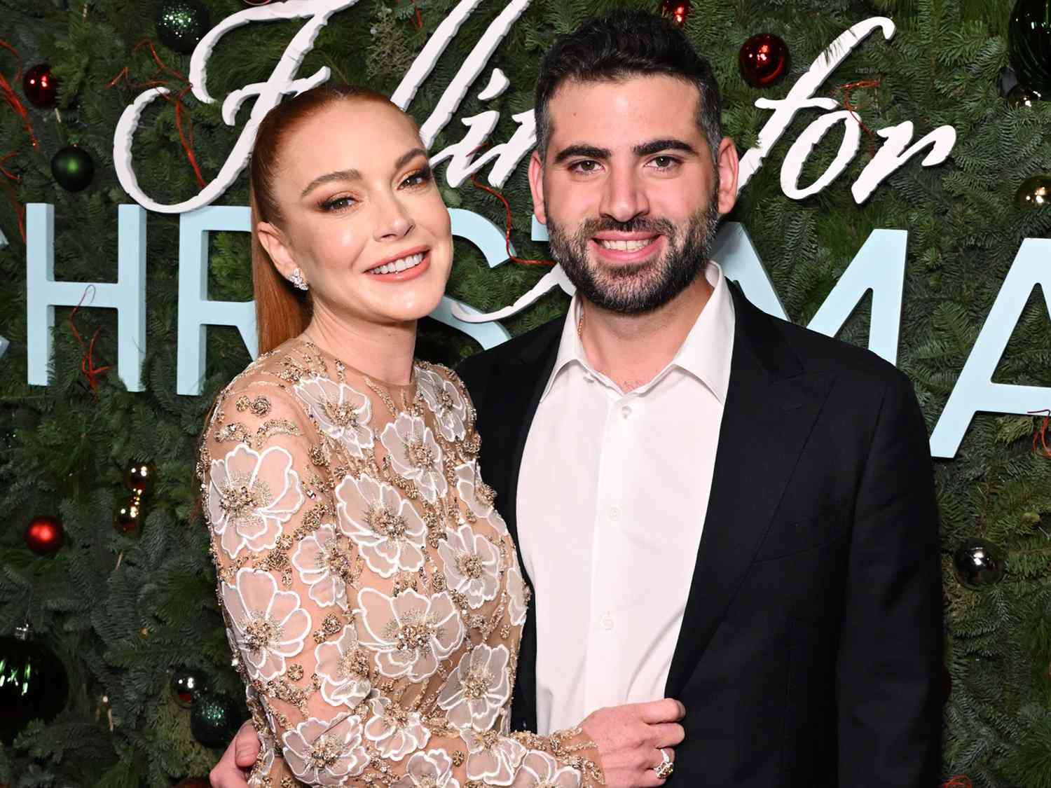 Lindsay Lohan and Bader Shammas at Netflix's Falling For Christmas Celebratory Holiday Fan Screening with Cast & Crew on November 9, 2022 in New York City.