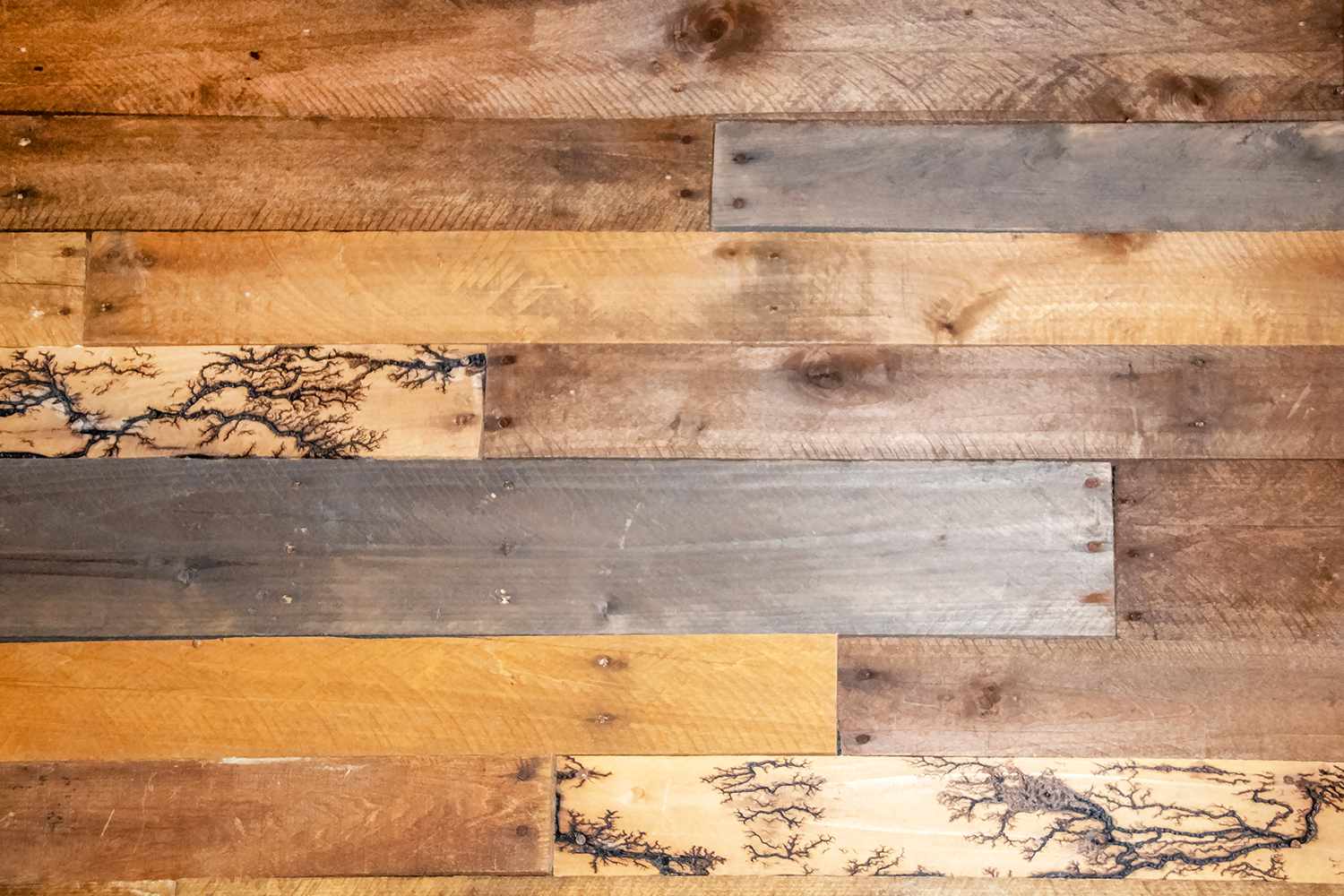 repurposed wood planks- a few have unusual fractal lightning high voltage lichtenberg wood burning patterns