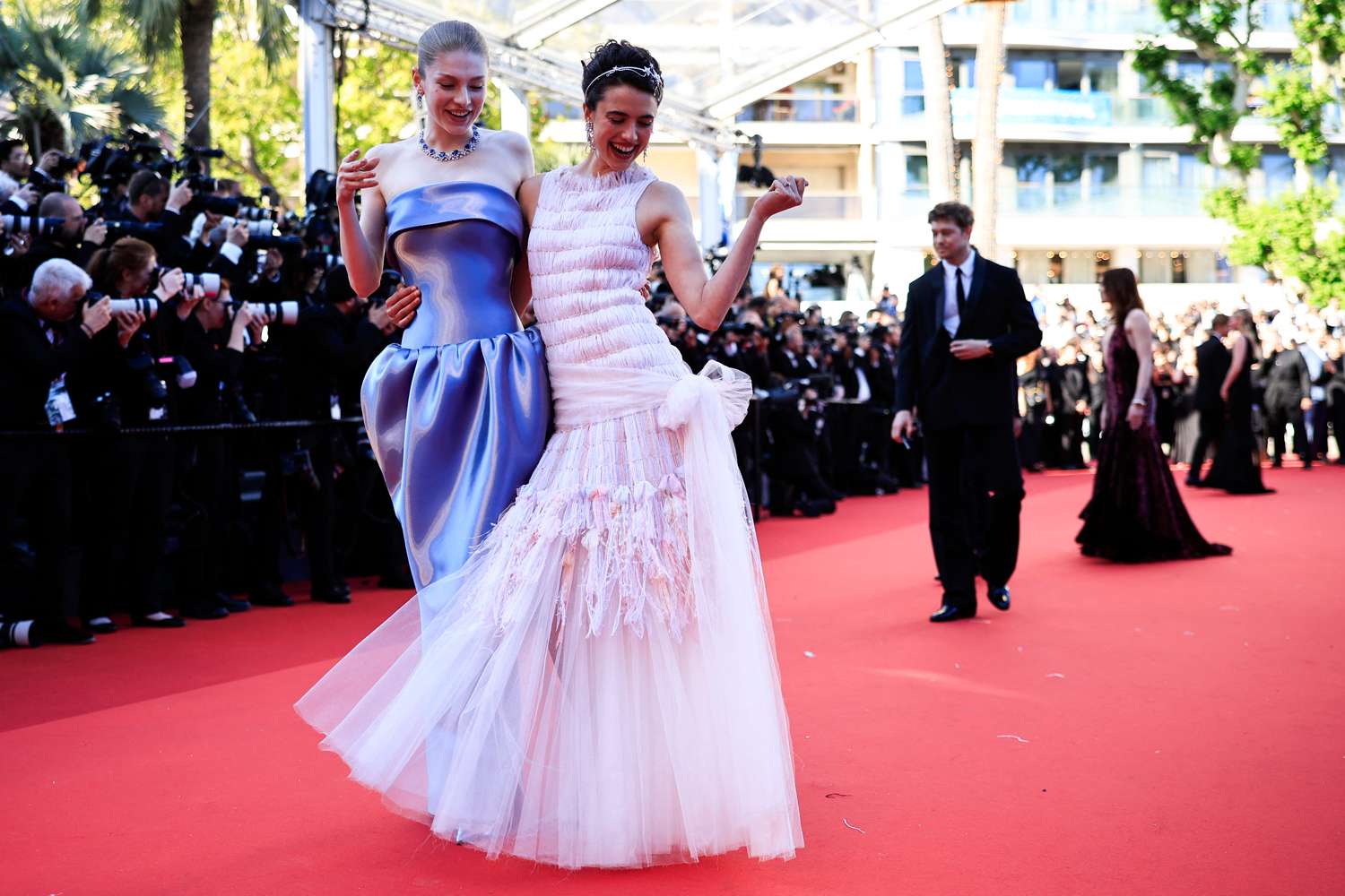 Hunter Schafer (L) and US actress Margaret Qualley arrive for the screening of the film "Kinds Of Kindness" at the 77th 