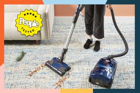 person vacuuming floor with Kenmore Pet Friendly Pop-N-Go Canister Vacuum
