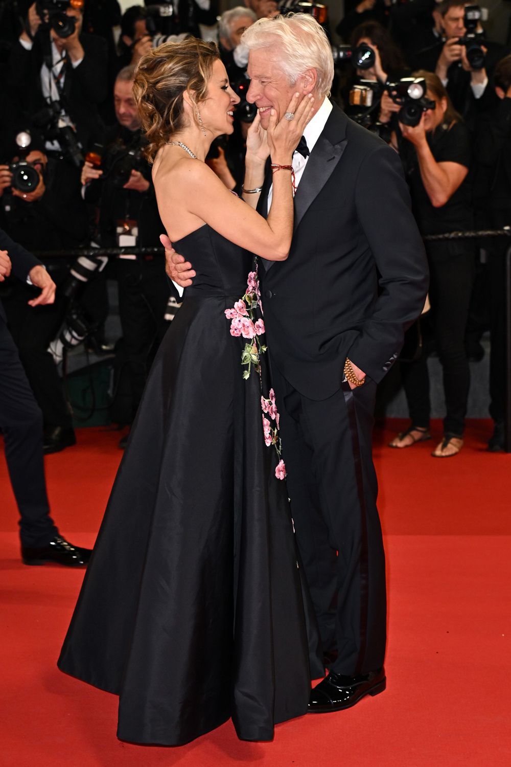 Alejandra Silva and Richard Gere attend the "Oh, Canada" Red Carpet at the 77th annual Cannes Film Festival at Palais 