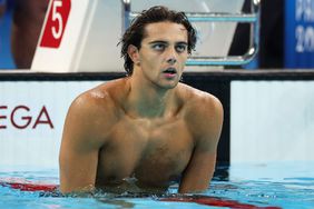 Thomas Ceccon of Team Italy celebrates after winning gold in the Men's 100m Backstroke Final on day three of the Olympic Games Paris 2024 at Paris La Defense Arena on July 29, 2024