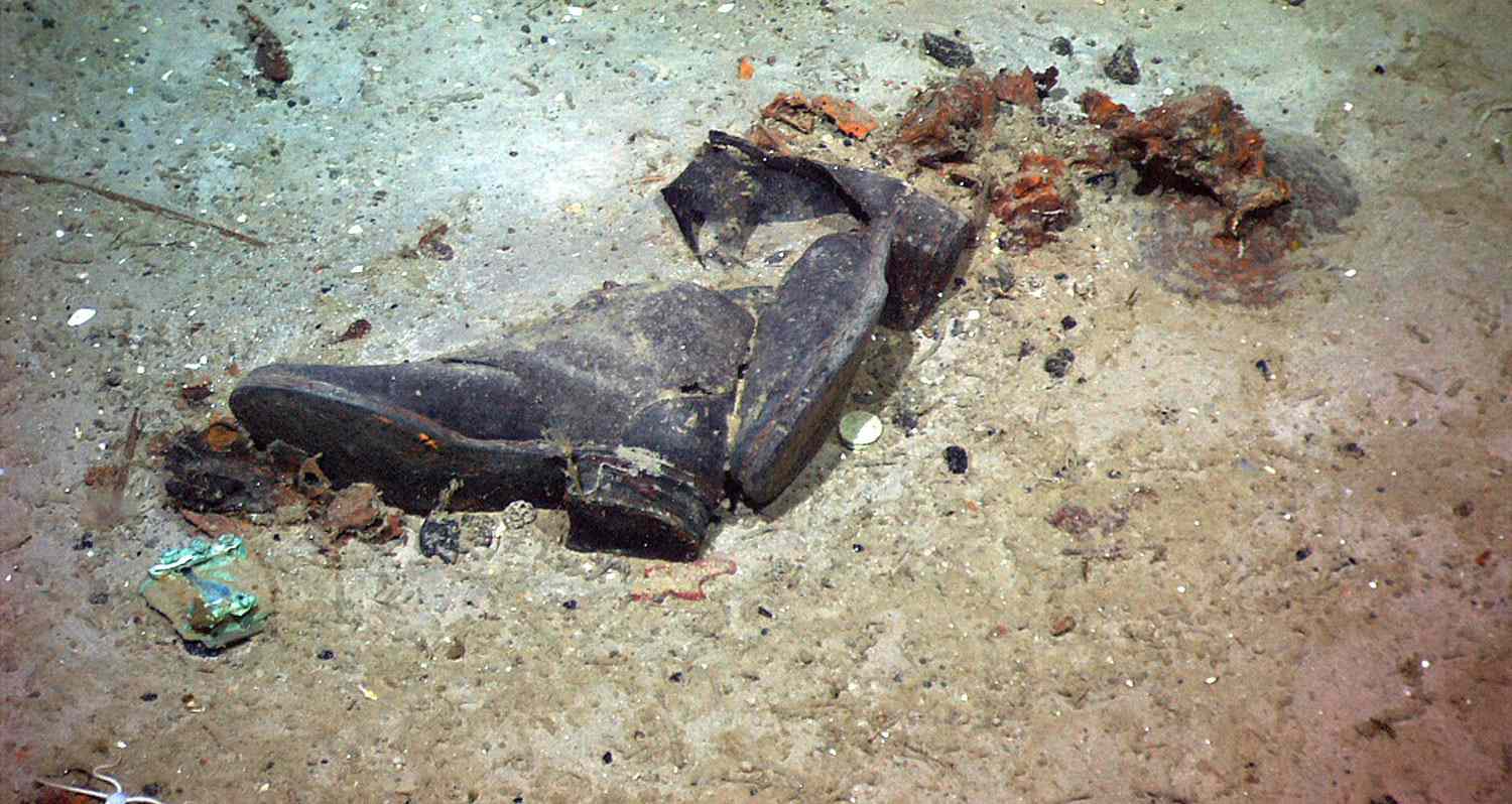 The shoes of a Titanic victim are photographed in a debris field near the stern of the ship 6/6 by the ROV Hercules during an expedition returning to the Titanic. It is lead by the man who discovered the wreck, Dr. Robert Ballard. They are the NOAA ship Ronald H. Brown. Images are video images from National Geographic Channel's program "Return to Titanic" - Apr 2012