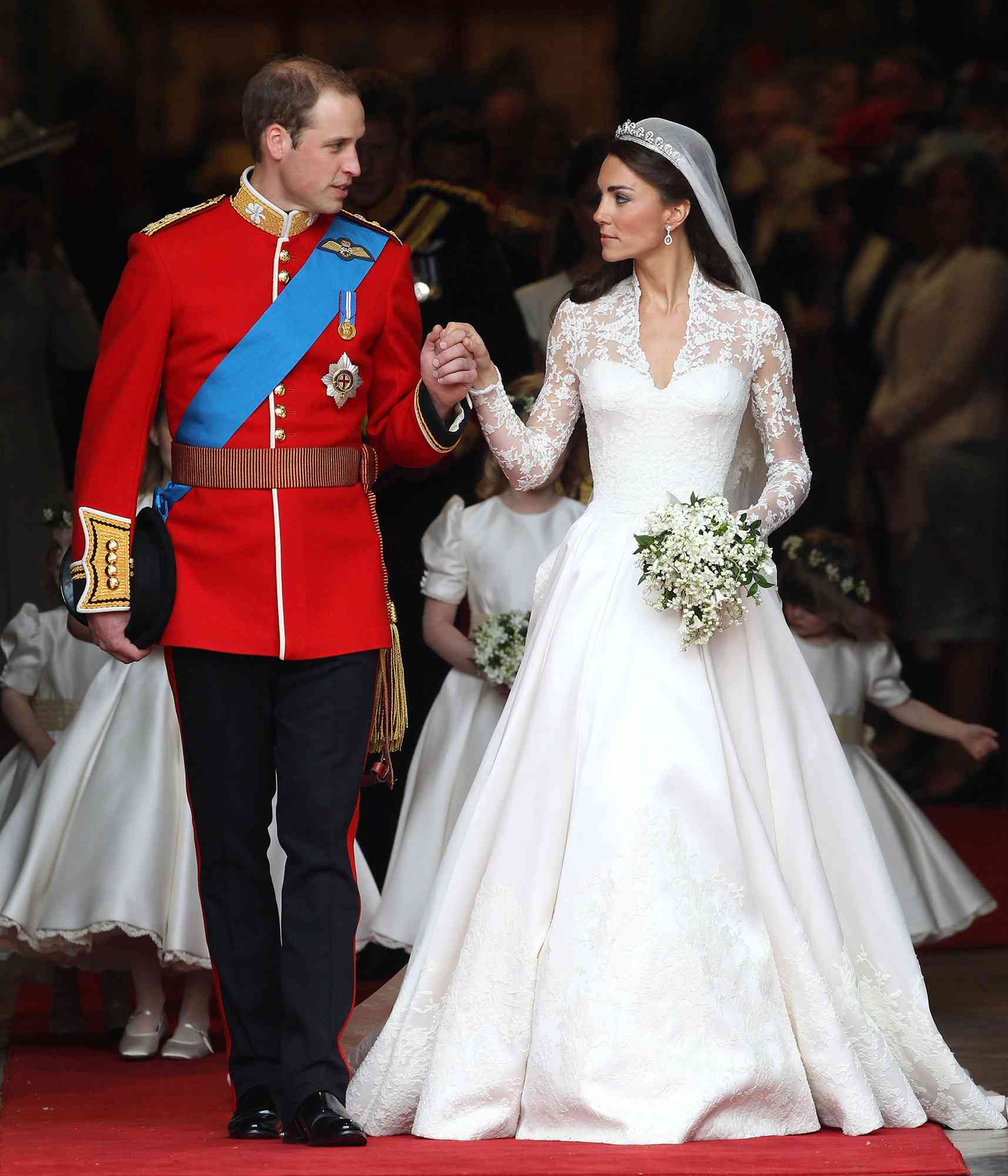 Prince William, Duke of Cambridge and Catherine, Duchess of Cambridge smile following their marriage at Westminster Abbey on April 29, 2011 in London, England