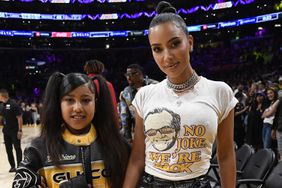 Kim Kardashian and daughter North West attend the the Western Conference Semifinal Playoff game