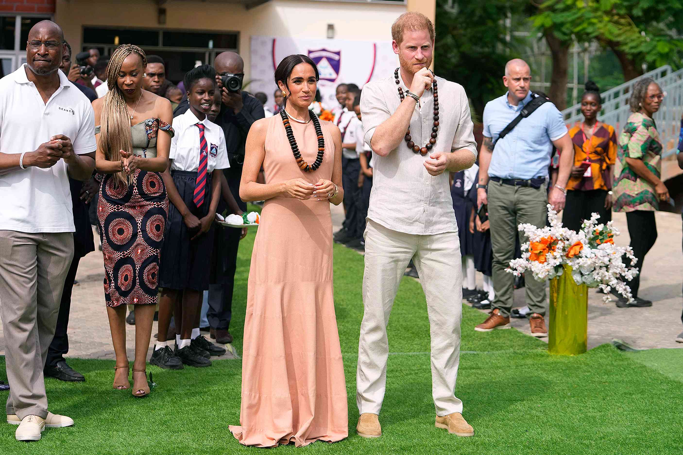 Prince Harry and Meghan visit children at the Lights Academy in Abuja, Nigeria, Friday, May 10, 2024. Prince Harry and his wife Meghan have arrived in Nigeria to champion the Invictus Games, which he founded to aid the rehabilitation of wounded and sick servicemembers and veterans. 