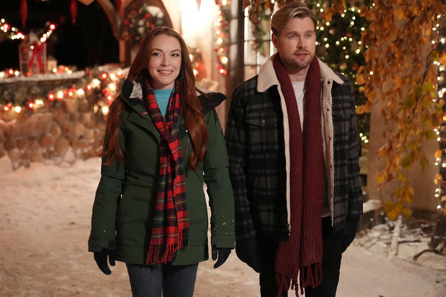 Christmas in Wonderland. (L-R) Lindsay Lohan as Sierra, Chord Overstreet as Jake in Christmas in Wonderland. Cr. Scott Everett White/Netflix Â© 2021