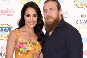 Brie Bella (L) and WWE Superstar Daniel Bryan attend FOX's 2014 Teen Choice Awards at The Shrine Auditorium on August 10, 2014 in Los Angeles, California