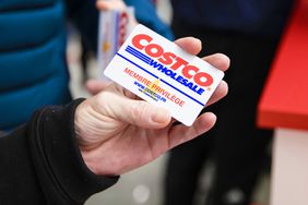 A customer shows their membership card in this arranged photograph inside a Costco Wholesale Corp.Â store in Villebon-sur-Yvette, France, on Friday, Nov. 3, 2017. About an hour south of Paris, a uniquely American import has opened for business.