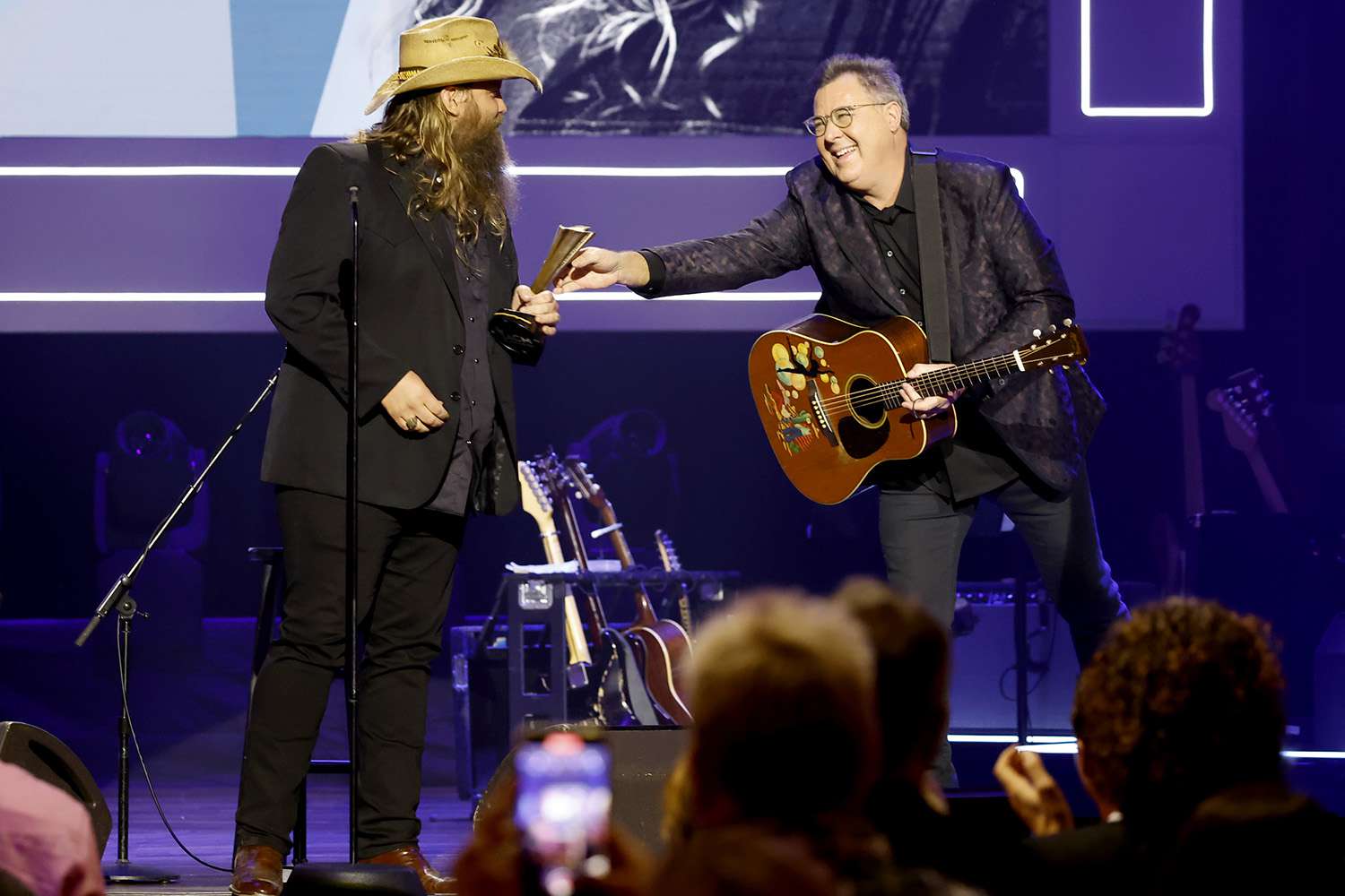 NASHVILLE, TENNESSEE - AUGUST 24: Spirit Award Honoree Chris Stapleton and Vince Gill onstage during the 15th Annual Academy Of Country Music Honors at Ryman Auditorium on August 24, 2022 in Nashville, Tennessee. (Photo by Jason Kempin/Getty Images for ACM)