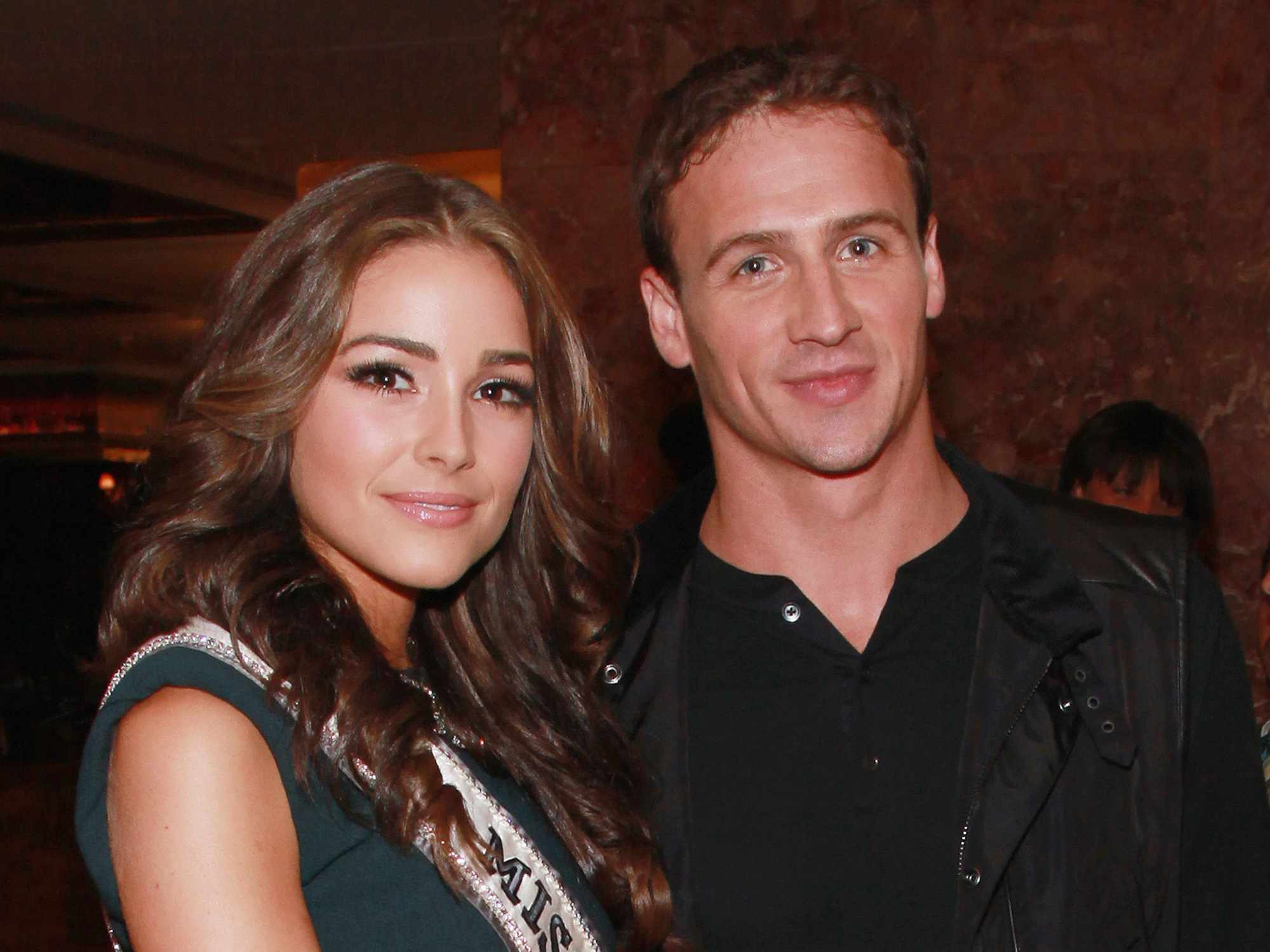 Olivia Culpo and swimmer Ryan Lochte attend the Evening Sherri Hill spring 2013 fashion show during Mercedes-Benz Fashion Week at Trump Tower Grand Corridor on September 7, 2012 in New York City