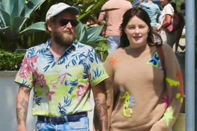 Jonah Hill and Olivia Millar embrace a serene stroll through breathtaking Malibu