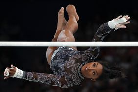 Simone Biles of Team USA competes on the uneven bars during the Women's Artistic Gymnastics Qualification on day two of the Olympic Games Paris 2024 at Bercy Arena on July 28, 2024 in Paris, France.