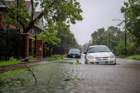 Vehicles sit in floodwater during Hurricane Beryl on July 08, 2024 in Houston, Texas
