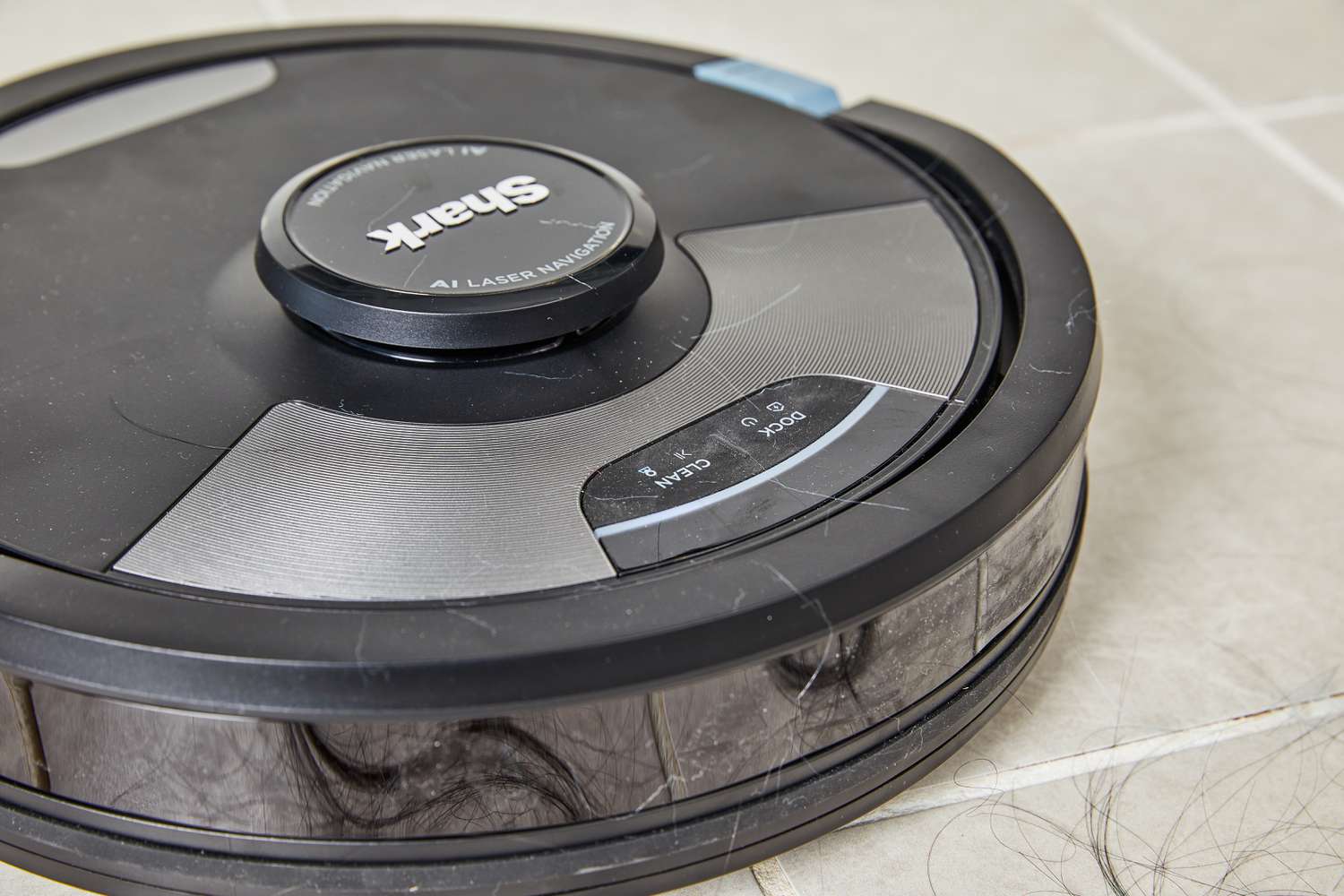 Shark AI Ultra 2-in-1 Robot Vacuum & Mop cleaning hair on tile floor