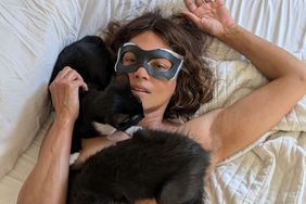 Halle Berry in cat mask, with her cats