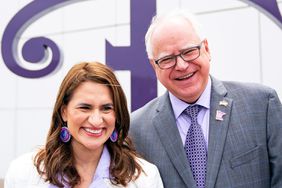 Minnesota Lieutenant Governor Peggy Flanagan and Governor Tim Walz pose for a photo after Walz signed a bill renaming a 7-mile stretch of Highway 5 as Prince Rogers Nelson Memorial Highway, Tuesday, May 09, 2023, at Paisley Park in Chanhassen, Minn