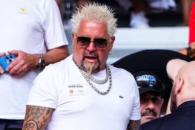 Guy Fieri, American television host attends the match between Carlos Alcaraz of Spain and Novak Djokovic of Serbia during the Men's Singles Gold medal match on Court Philippe-Chatrier at Roland-Garros Stadium during the Paris 2024