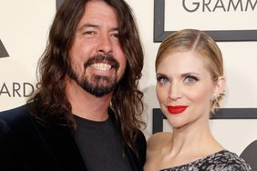 Dave Grohl of Foo Fighters (L) and Jordyn Blum attend The 58th GRAMMY Awards at Staples Center on February 15, 2016 in Los Angeles, California