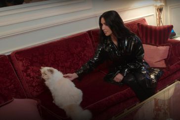 Kim Kardashian meeting Karl Lagerfeld's cat Choupette. 