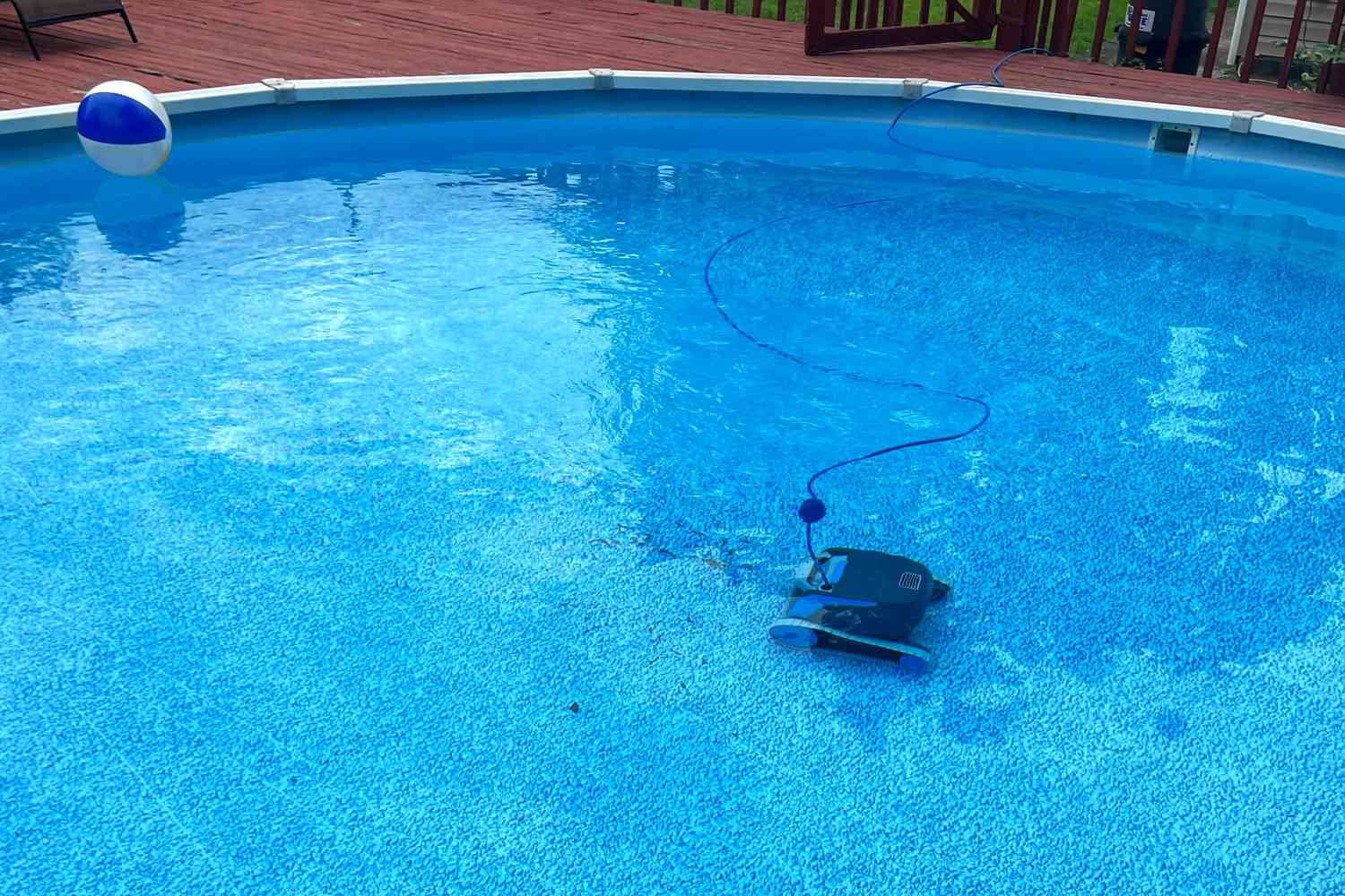 Dolphin Escape Robotic Above Ground Pool Cleaner on the bottom of a pool