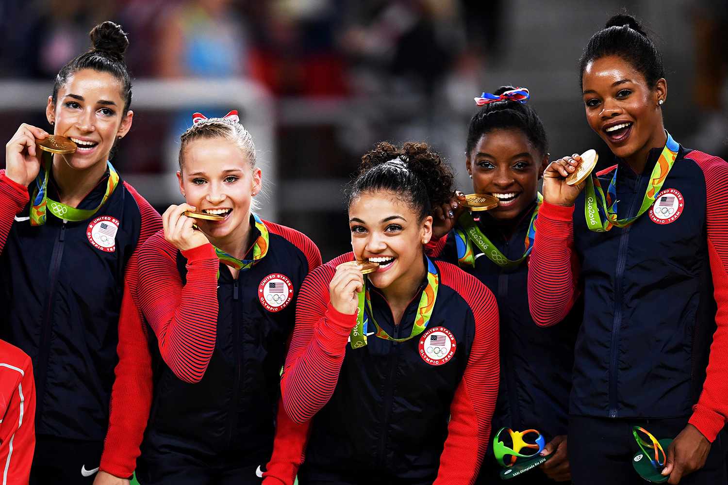 Gold medalists Alexandra Raisman, Madison Kocian, Lauren Hernandez, Simone Biles and Gabrielle Douglas of the United States pose for photographs on the podium at the medal ceremony for the Artistic Gymnastics Women's Team on Day 4 of the Rio 2016 Olympic Games at the Rio Olympic Arena on August 9, 2016 in Rio de Janeiro, Brazil.