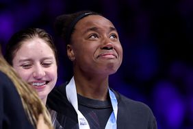 Simone Manuel of the United States reacts during the medal ceremony for the Women's 100m freestyle final on Day Five of the 2024 U.S. Olympic Team Swimming Trials at Lucas Oil Stadium on June 19, 2024